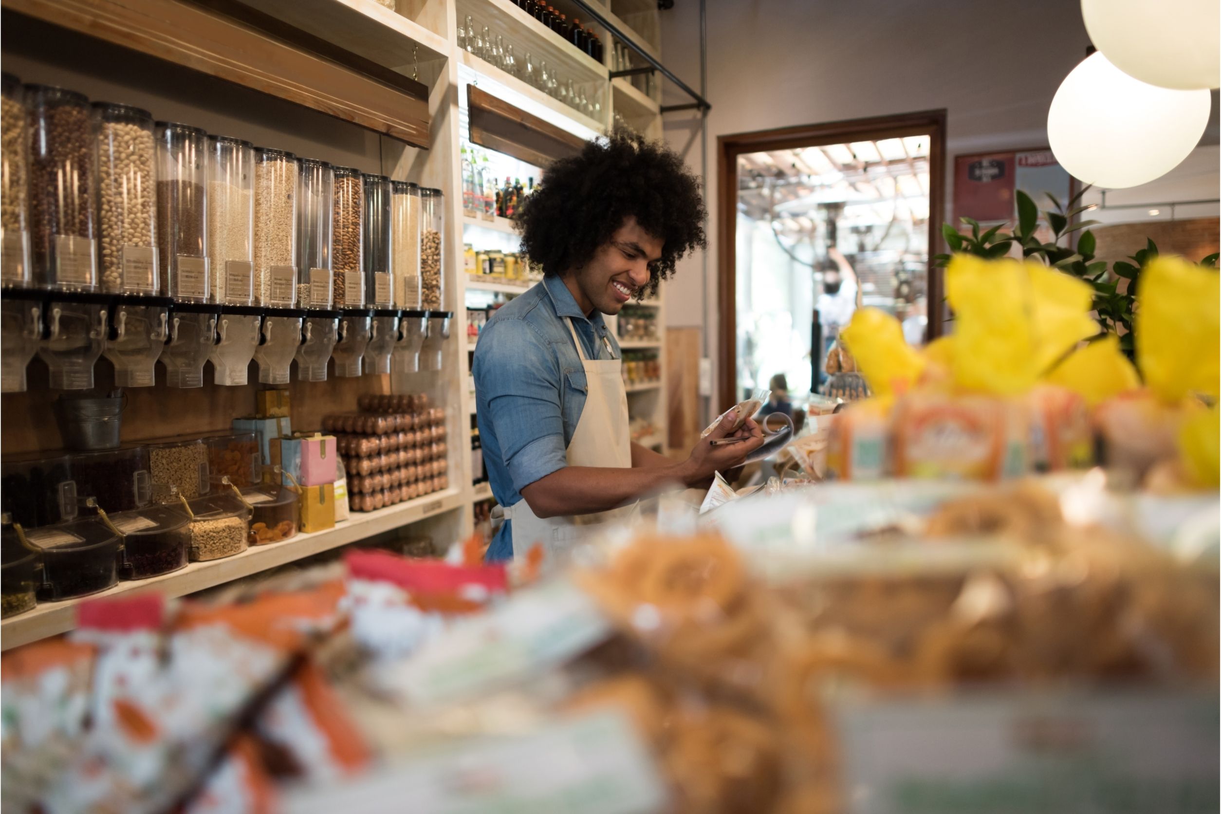 man working in a specialty grocery store