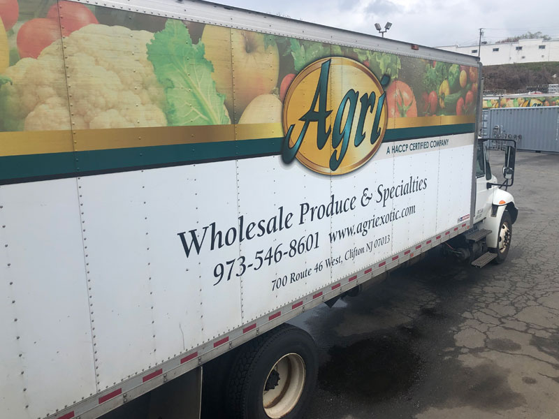 agri exotic trading order delivery truck with the text: Wholesale Produce and Specialties