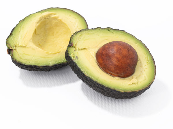 organic avocado cut in half