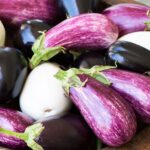 different types of eggplant all in a bowl together.